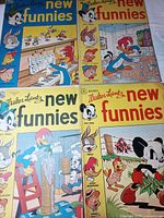 All four comic book fronts displayed