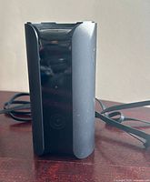 Front view of Canary View camera showing overall design and attached USB cable