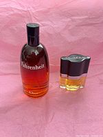 Dior Fahrenheit and Oscar perfume bottles side by side