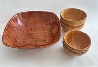 Group view of large square bowl and four round bamboo snack bowls
