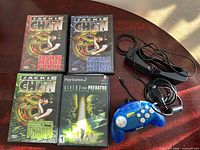 Group shot of DVDs, PS2 game, VR glasses, controller