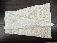 Tablecloth folded showing overall lace pattern