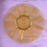 top view showing scalloped flower shape amber plate