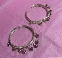 Both bangles showing bell attachments and overall design