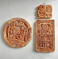 All three ceramic plaques shown together for identification and style