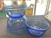 Two cobalt blue glass bowls displayed, illustrating color and material