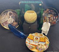 Group shot of all items including Avon bottles, vases, plates, boxes