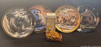 Group shot of four cat plates, boxed night light and tiger trinket box