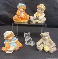 Group shot of four Calico Kittens figurines and clear glass cat
