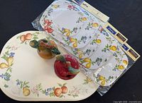 Packaged Corelle placemats and loose matching mats displayed