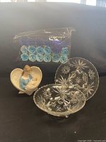 Group shot showing rose soap pack, angel figurine, and two pressed-glass dishes