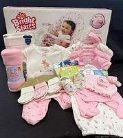 Group shot of entire lot including boxed bouncer and clothing items