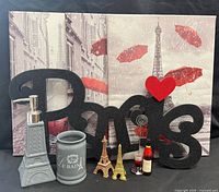 Group shot showing all decor pieces including large two-panel canvas, sign, bath accessories, mini towers, wine bottle card holder