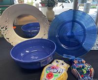 Overall lot showing blue glass charger, blue bowl, white ceramic mirror frame, two Talavera owl plaques