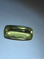 Top view of lemon citrine showing cushion cut and yellow colour