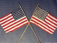 Two 48-star flags crossed to show entire lot