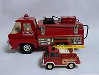 Structo and Tootsietoy fire trucks side view