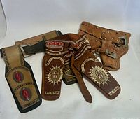 Group shot of all three vintage holster items