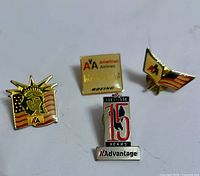 Front view of all four American Airlines lapel pins