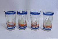 Front view of all four sailboat juice glasses