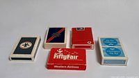 All five boxed airline card decks front view