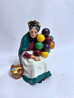 Front view of the figurine showing overall design and colours