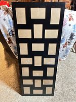 Front view of black 21-opening collage picture frame