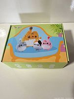 Closed box showing illustrated cat family kit front