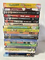Stack of twelve DVD cases showing titles and spines