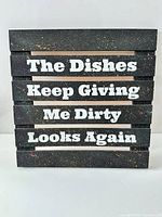 Front view of wooden sign showing text and finish