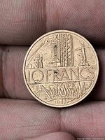 Reverse side displaying 10 FRANCS denomination with industrial-agricultural motif