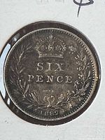 Reverse of 1887 sixpence showing crown, wreath, denomination and date