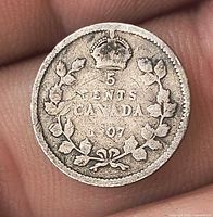 Reverse side showing 5 CENTS CANADA 1907 within wreath and crown