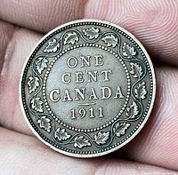 Reverse showing denomination and date within maple leaf wreath