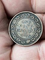 Reverse showing ONE CENT CANADA 1913 with maple leaf border