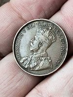 Obverse showing King George V crowned bust with legend GEORGIVS V DEI GRA REX ET IND IMP
