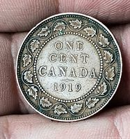Reverse of 1919 Canada large cent showing denomination and date within maple leaf wreath