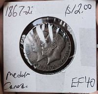 Obverse of medallion with conjoined busts and dates 1867-1927