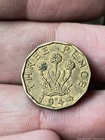 Reverse showing THREE PENCE 1944 thrift design