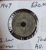 Obverse showing crowned monogram cross design, year 1947, coin seated in flip