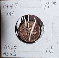 Front of 1947 maple leaf 1-cent coin in holder