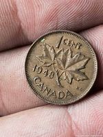 Reverse of 1948 Canadian 1-cent coin showing maple leaf design and date