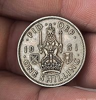 Reverse showing crowned lion, date 1951, ONE SHILLING legend