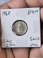 Obverse view of 1968 Swiss 1/2 Franc coin in holder