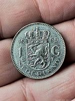 Reverse side showing crowned coat of arms, date 1969, denomination 1 G