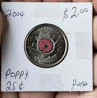 Reverse of 2004 Canadian poppy quarter in holder