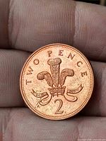 Reverse showing Prince of Wales feathers, denomination and legend