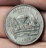 Reverse showing Arkansas design with mallard, rice, diamond, date 2003