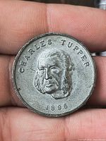 Obverse showing portrait, name and 1896 date