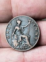 Reverse side showing Britannia, denomination, date